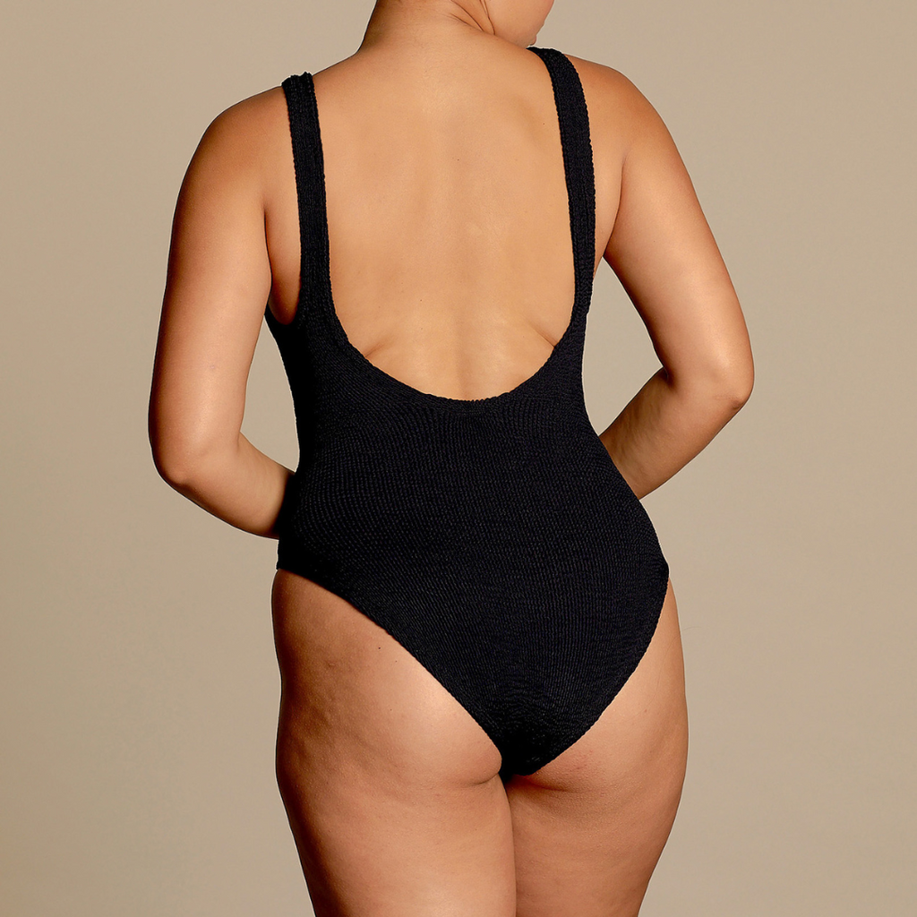 Hunza G iconic Domino crinkle one size one piece Swimsuit in black with tortoiseshell ring details on straps