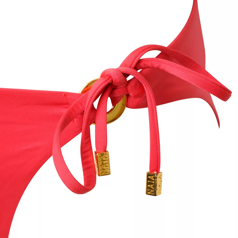 NAIA beach luxury Eze coral red bikini pant with tie sides in Mustique Magenta, Abersoch, North Wales coastal Culture