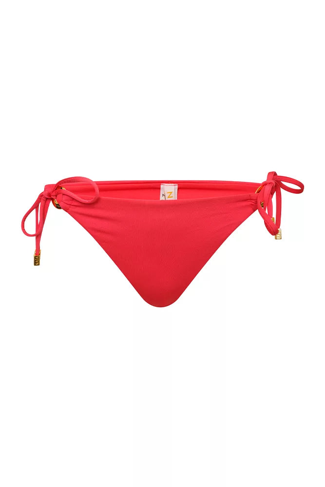 NAIA beach luxury Eze coral red bikini pant with tie sides in Mustique Magenta