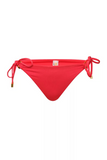 NAIA beach luxury Eze coral red bikini pant with tie sides in Mustique Magenta, coastal culture Abersoch, North Wales 