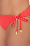 NAIA beach luxury Eze coral red bikini pant bottom with tie sides in Mustique Magenta, Abersoch, North Wales